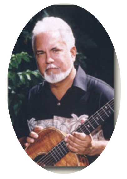 John Keawe holding a guitar